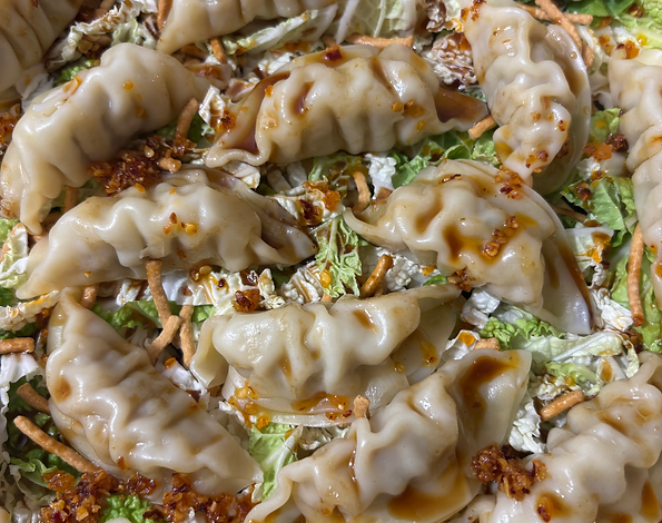 Pan-fried dumplings with scallion oil and sesame