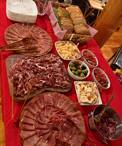 Italian charcuterie board with salumi, olives and bread