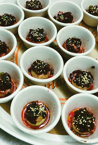 Eggplant and mushroom bites in ramekins with sesame and chili oil