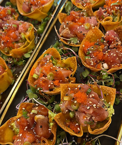 Tuna tartare in crispy wonton cups with tobiko and microgreens